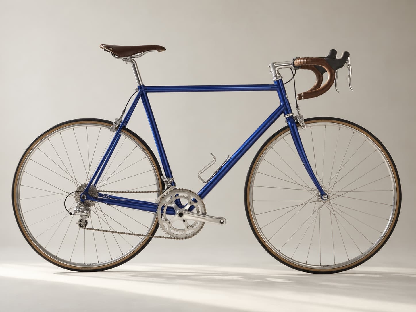 A cobalt-blue steel road bicycle presented as a design object